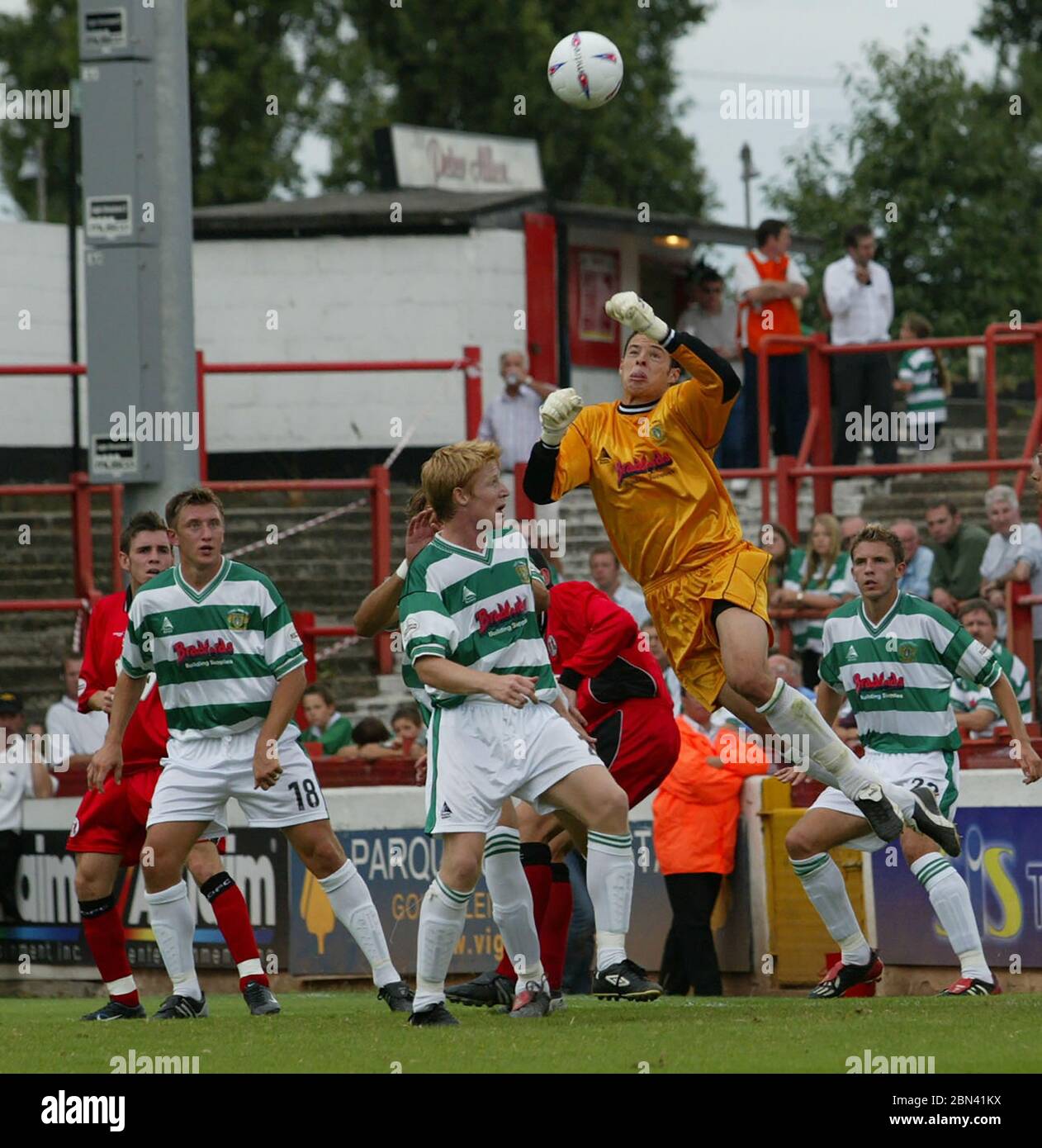 LONDON, UK. AUGUST 23: CHRIS WEALE of Yeovil Town (Yellow shirt) during League Division 3 between Leyton Orient and Yeovil Town at Matchroom stadium, Stock Photo
