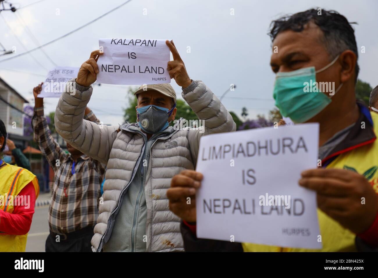 Kathmandu, Nepal. 12th May, 2020. Human Rights Activists hold playcard  during protesting against the government of India for construction of a  road to Lipulekh on the border with China, the road passes
