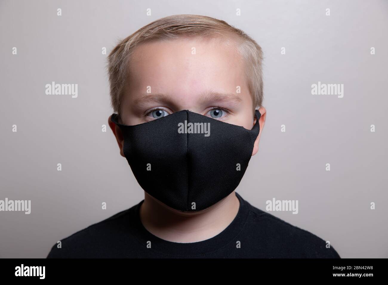 Boy trying to prevent the spread of disease Stock Photo