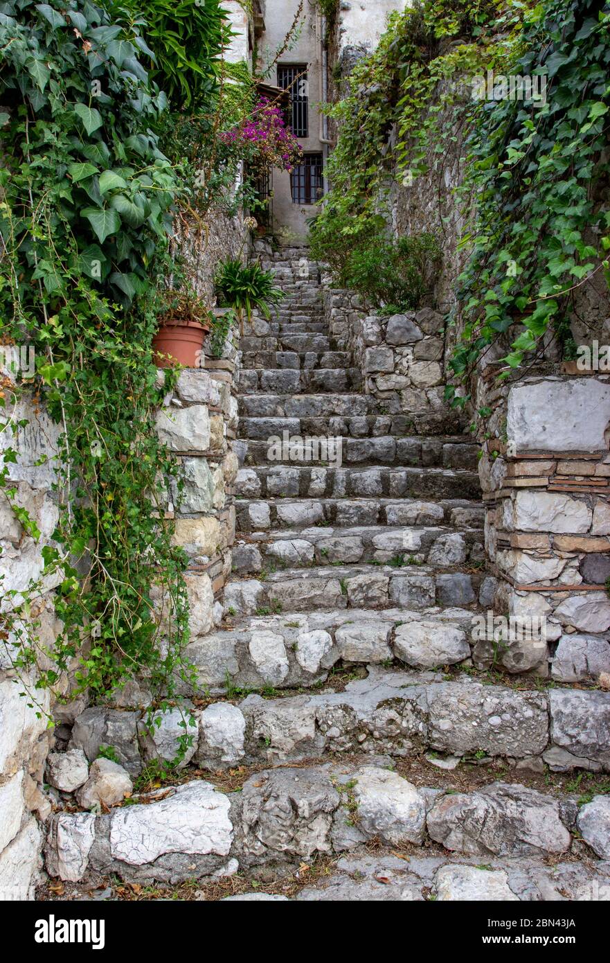 A narrow stone staircase ascends towards a house in the town of Saint-Paul-de-Vence, France Stock Photo