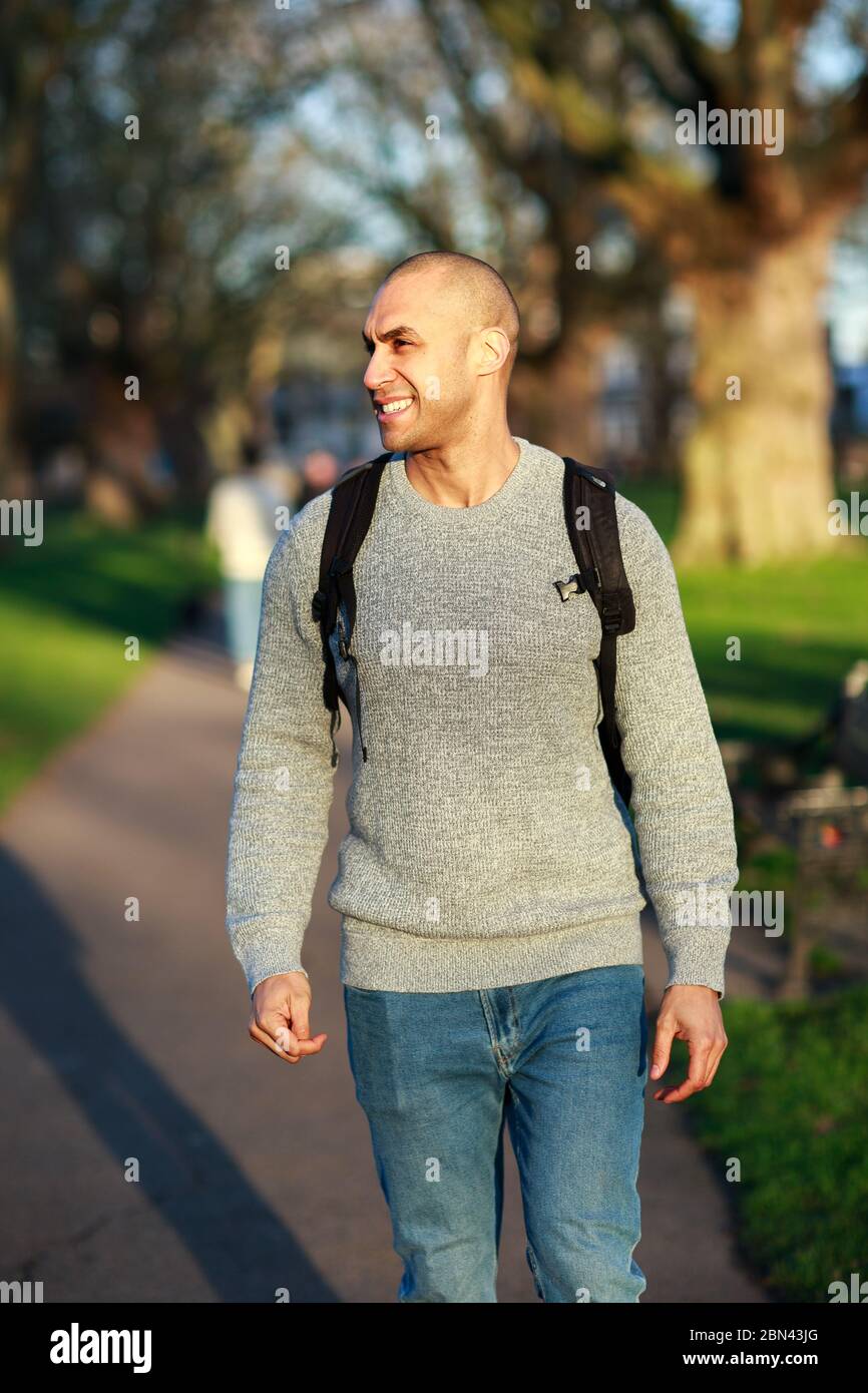 Young man walking through hi-res stock photography and images - Alamy