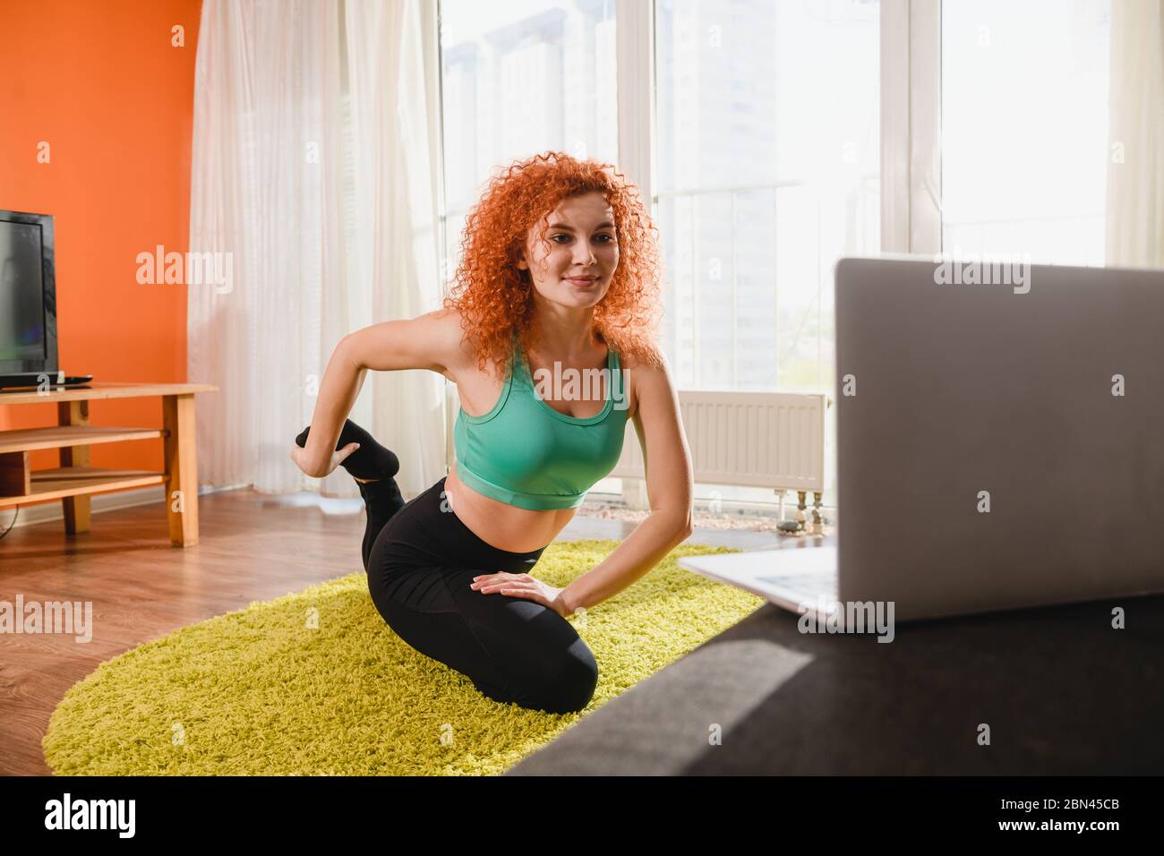 Home sportive exercises, gym stretching with laptop online workshop ...