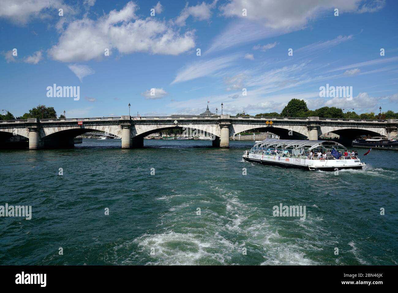 Tour boat in River Seine with Pont de la Concorde and top of Grand Palais in the background.Paris.France Stock Photo