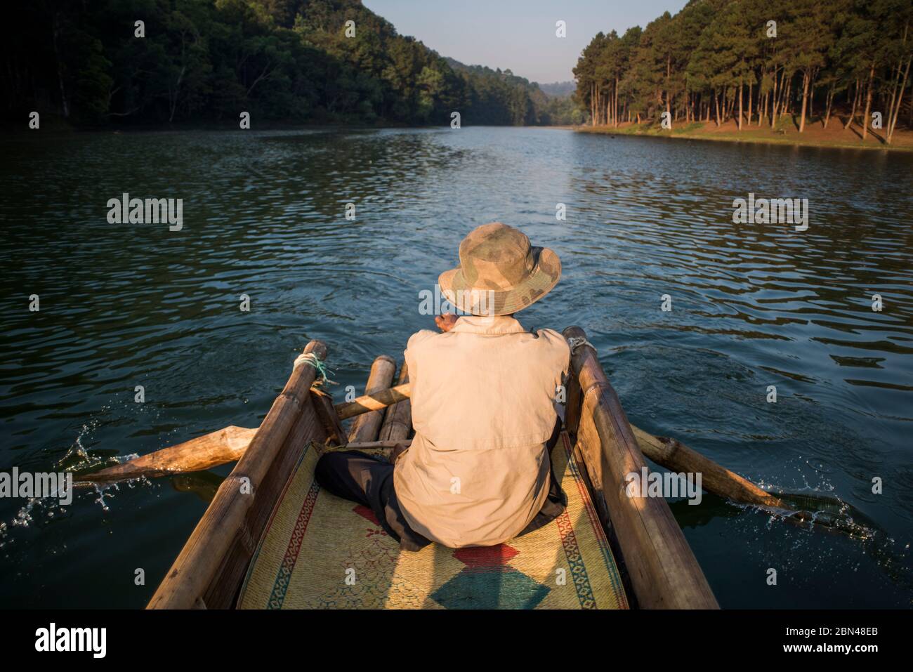 Bamboo raft ride at sunrise at Pang Ung Lake, Mae Hong Son, Thailand. Stock Photo