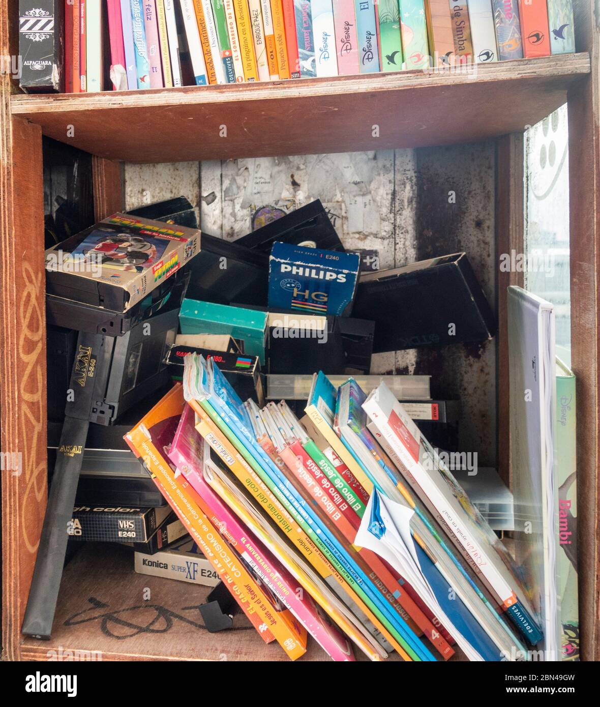 Former telephone kiosk, booth, box used to exchange books and videos in