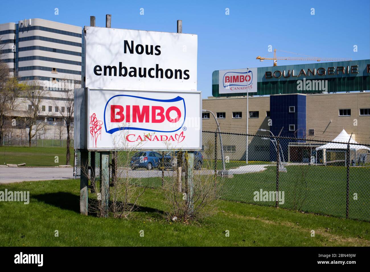 'We hire' sign outside the Bimbo Canada Bread factory in east end of Montreal Stock Photo