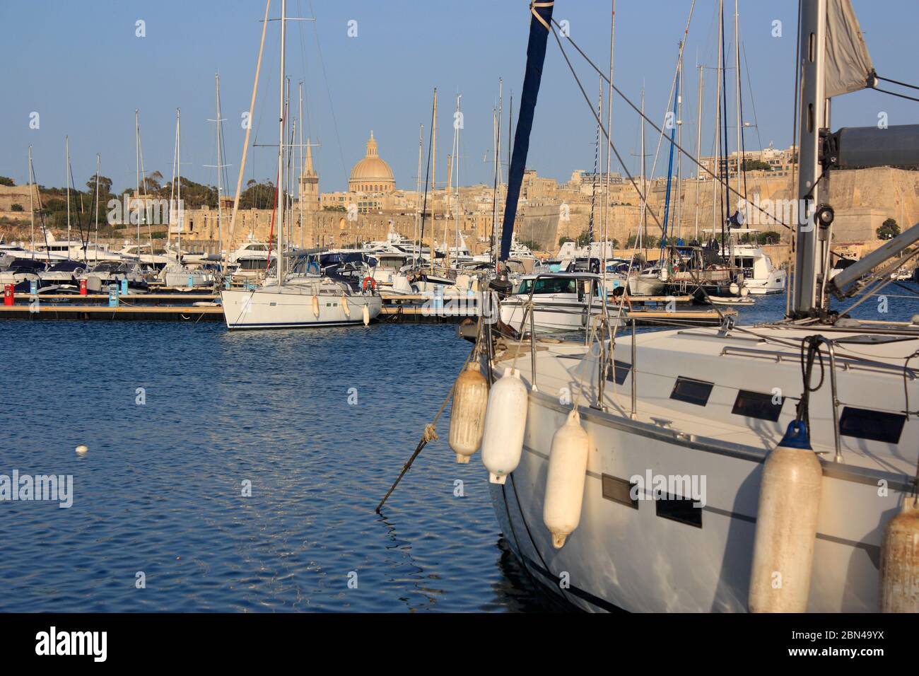 Yachts at Ta' Xbiex Yacht Marina, Malta, with Valletta in the background. Mediterranean expatriate lifestyle. Stock Photo