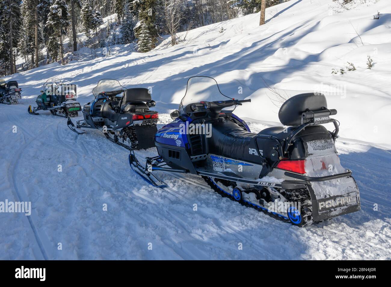 Snowmobiles along snow covered path, Sun Peaks Resort, Sun Peaks, British Columbia, Canada Stock Photo