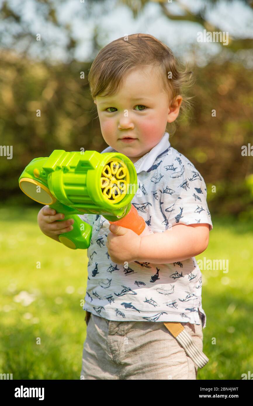 Bubble gun child hires stock photography and images Alamy