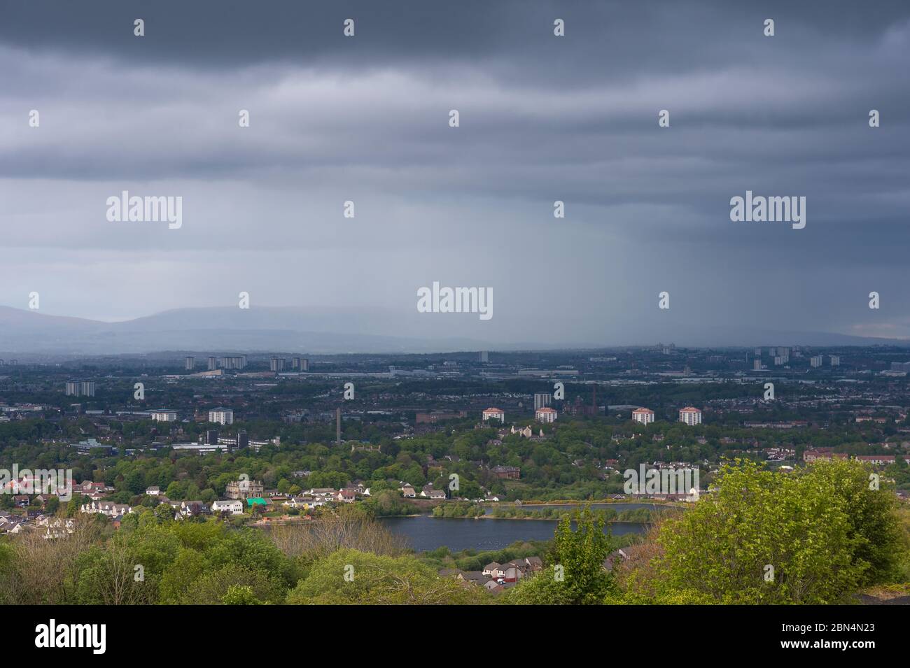 Glasgow Scotland Uk 12th May Pictured Looking North Over Glasgow With The Campsie Fells In The Background Surrounded By A Veil Of Rain And Dark Clouds With A Cloud Base Of