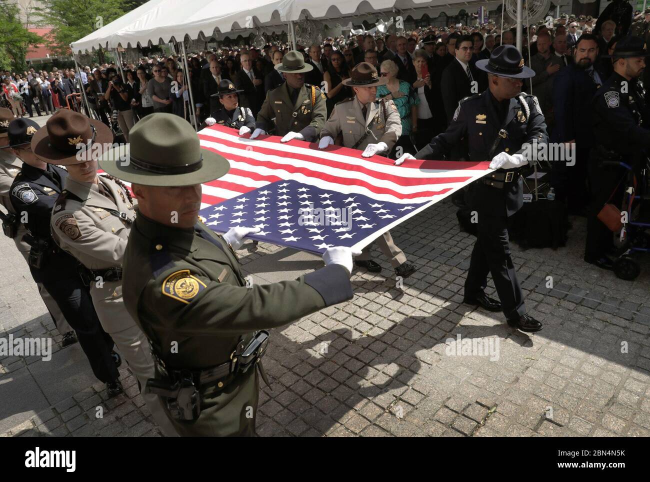 The U.S. Customs and Border Protection honor guard carries the U.S. Flag forward to be folded for encasement during the annual Valor Memorial & Wreath Laying Ceremony held in Woodrow Wilson Plaza outside the Ronald Reagan Building in Washington, D.C., May 16, 2019. CBP Stock Photo