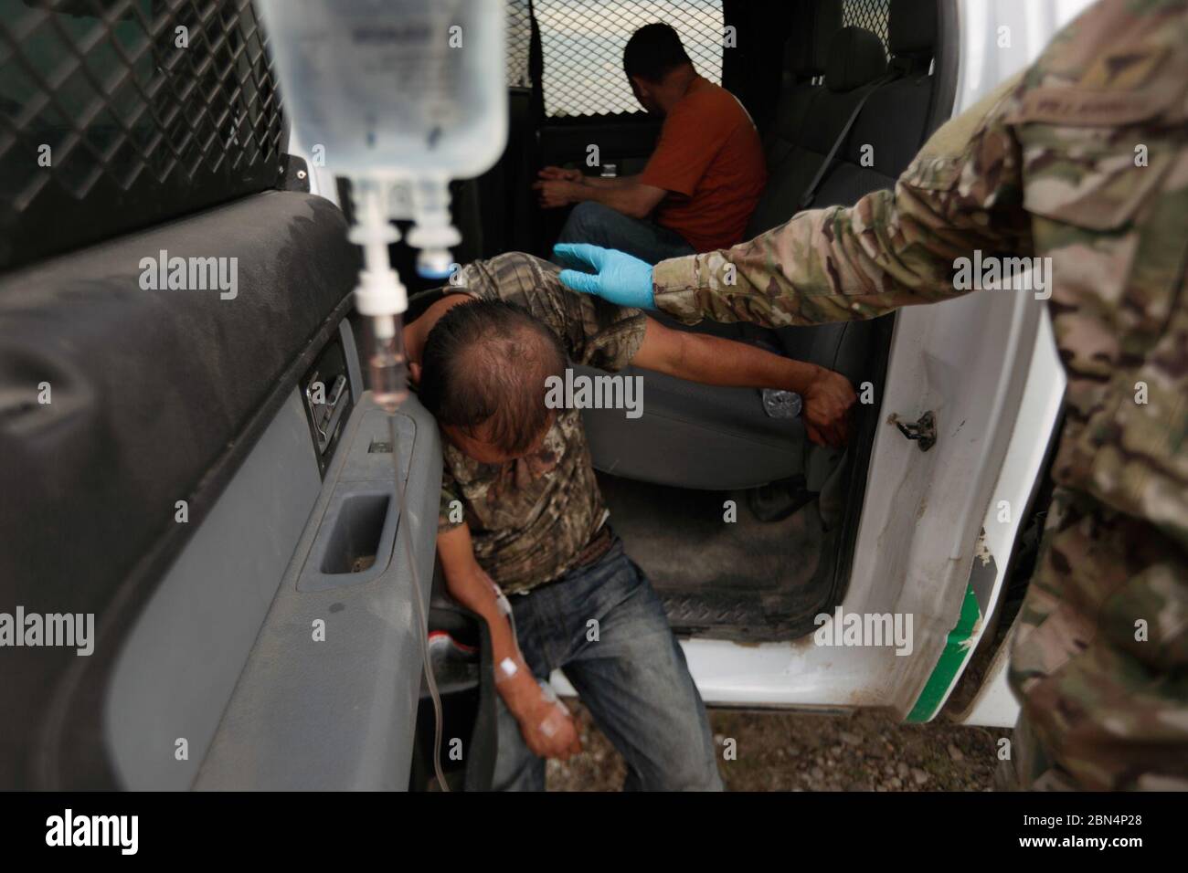 On June 20, 2019, a BORSTAR agent assists an illegal migrant suffering ...