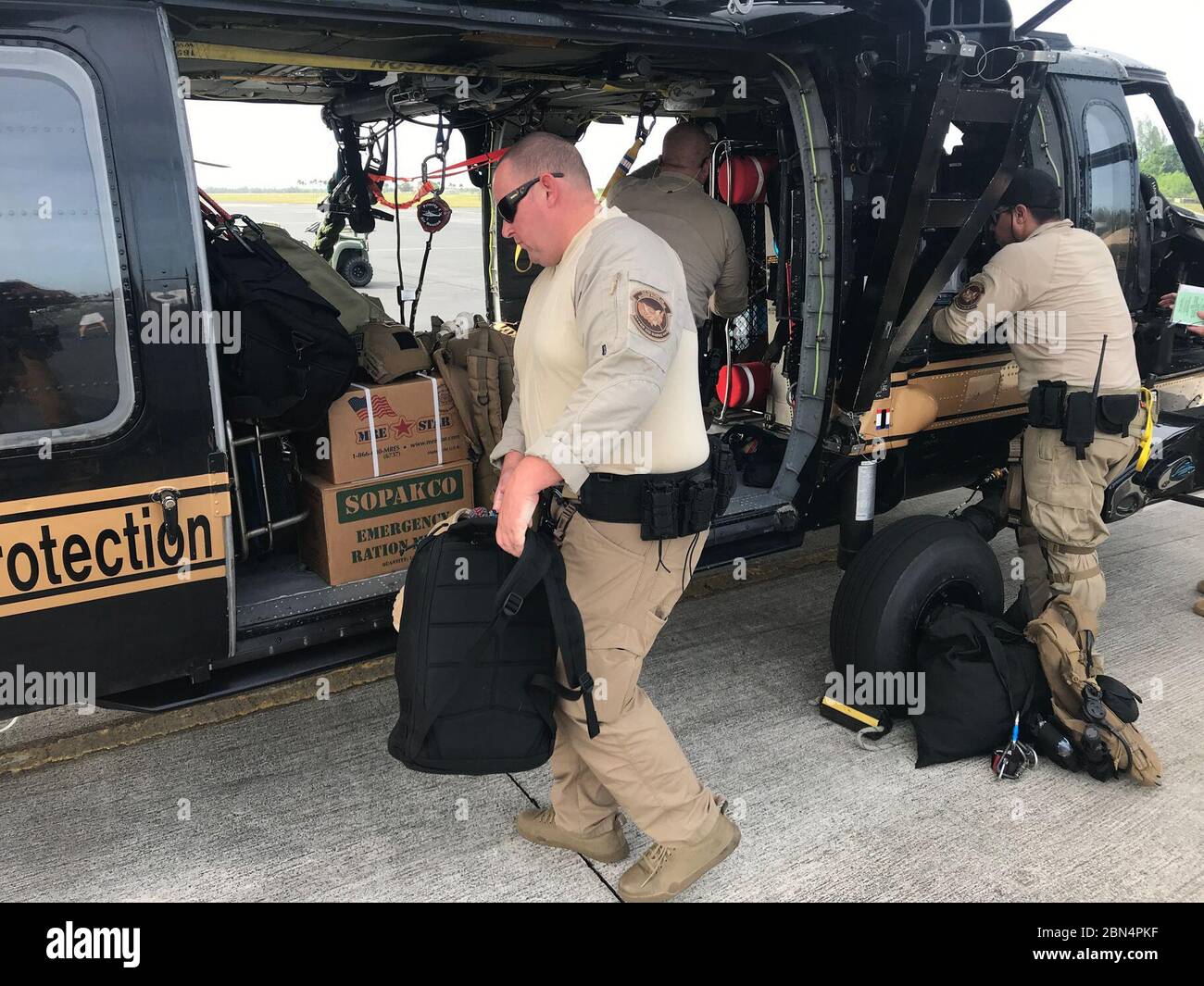 U.S. Customs and Border Protection AMO agents conduct a pre-flight brief and load their aircraft with emergency supplies prior to conducting a relief mission to the Bahamas in the aftermath of Hurricane Dorian, in Homestead, Fla., Sept 3, 2019.  CBP Stock Photo