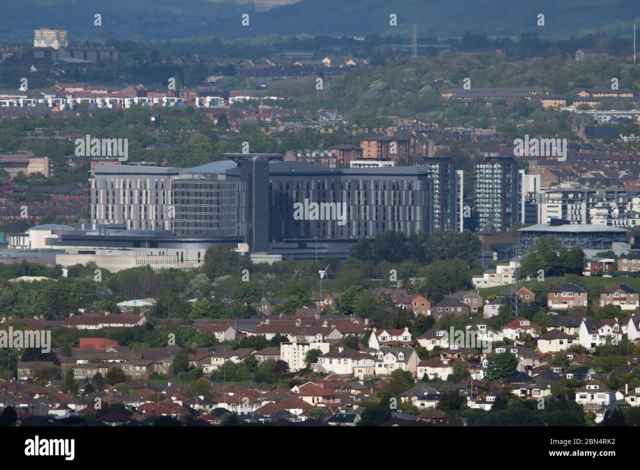 Glasgow, Scotland, UK. 12th May, 2020. Pictured: Telephoto view of the Queen Elizabeth University Hospital (QEUH) which is run by NHS Greater Glasgow and Clyde health board. The Scottish Government are under pressure to release information on hospital acquired COVID19 at the QEUH. In Scotland to date, a total of 75,570 people have been tested, with 13,763 people testing positive and 1,912 deaths. Credit: Colin Fisher/Alamy Live News Stock Photo