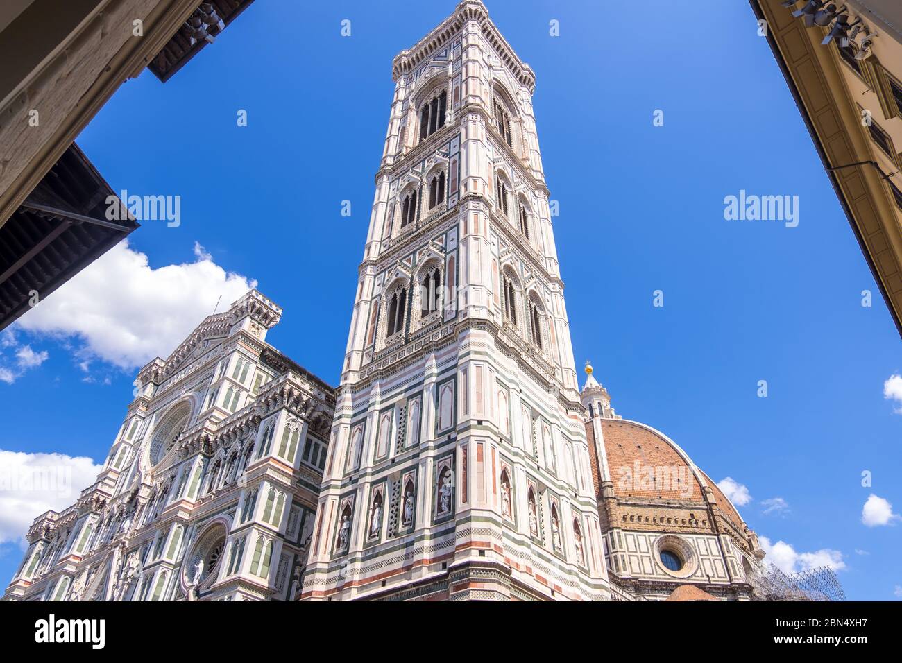 Florence, Italy - August 16, 2019: Cathedral Santa Maria Del Fiore and Giotto's Campanile on Piazza del Duomo in Florence Stock Photo