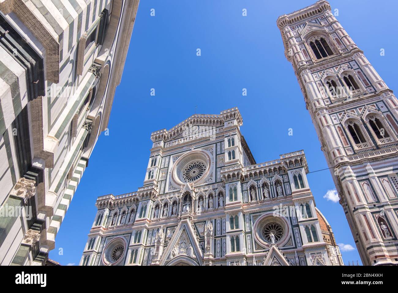 Florence, Italy - August 16, 2019: Cathedral Santa Maria Del Fiore with Giotto's Campanile and Baptistery of St. John on Piazza del Duomo in Florence Stock Photo
