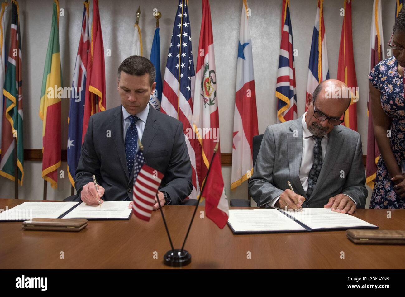 U.S. Customs and Border Protection Commissioner Kevin K. McAleenan and Director General of the National Superintendence of Customs and Tax Administration of Peru Rafael Garcia sign a memorandum of understanding on cargo April 24, 2018. U.S. Customs and Border Protection Stock Photo