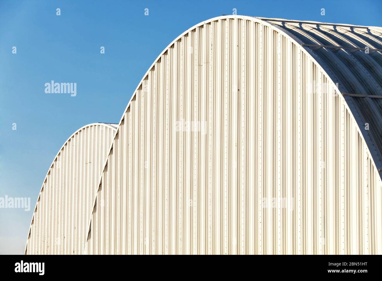 An abstract  close up view of two corrugated metal potato cellars in the Idaho potato fields. Stock Photo