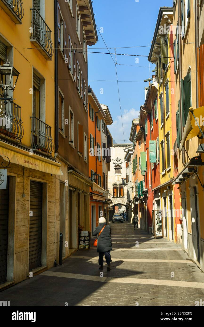 View of a narrow alley in the historic centre of the old town of Garda in a sunny day, Verona province, Veneto, Italy Stock Photo