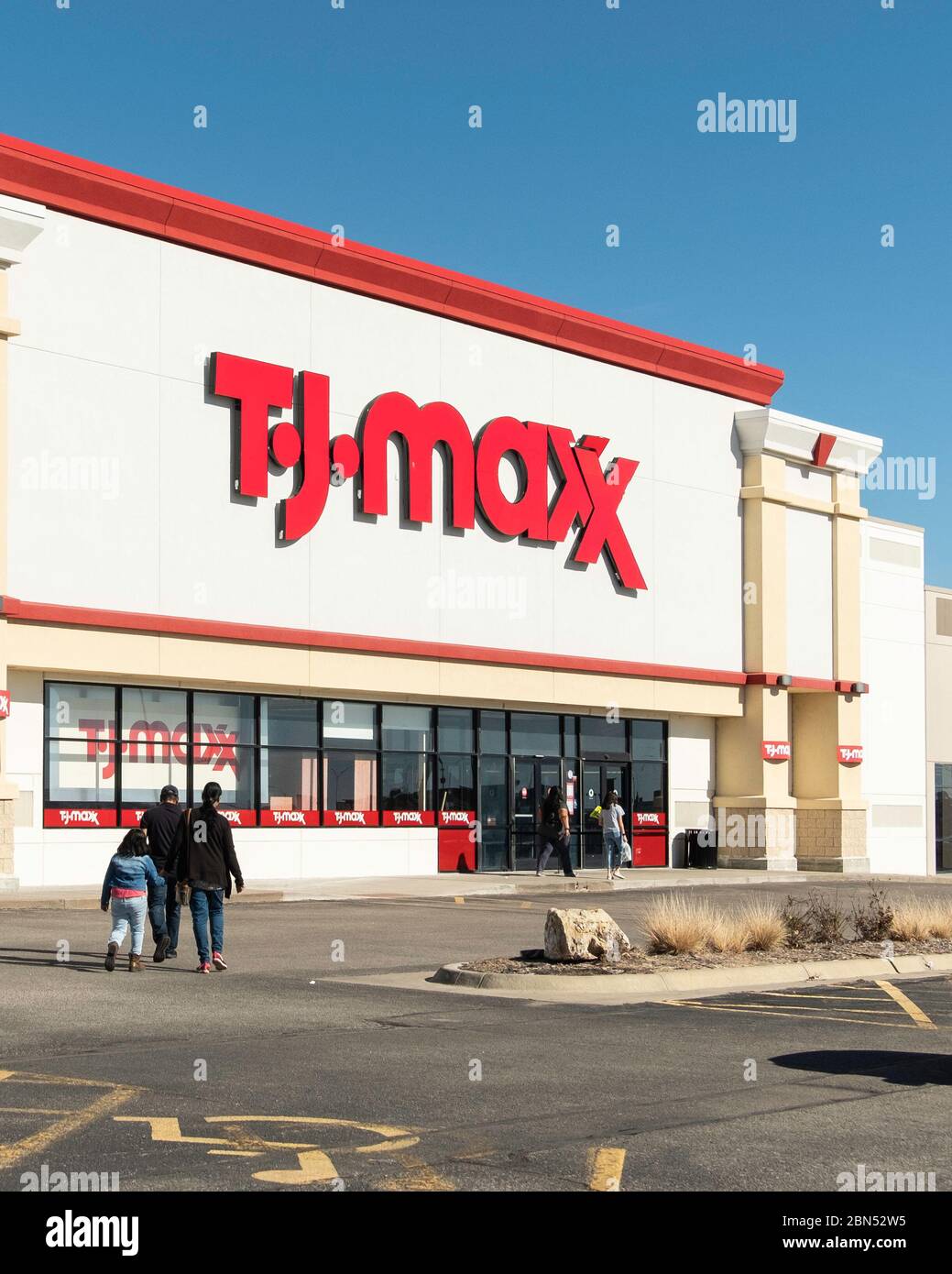 The storefront of TJ Maxx with customers entering. Wichita, Kansas, USA. Stock Photo