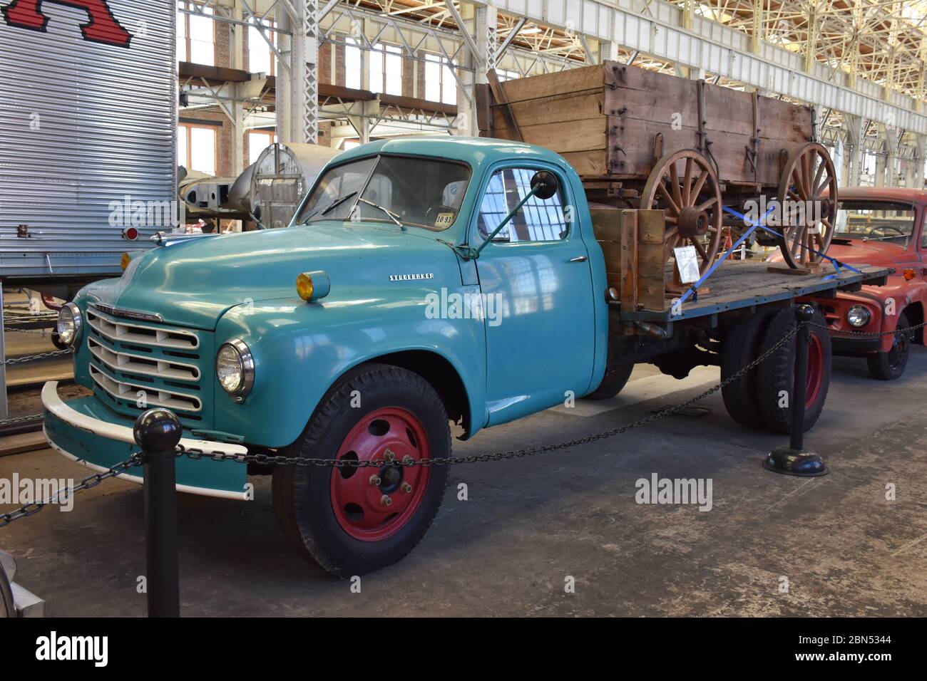 A Studebaker Truck with a wagon loaded on the back on display at the North Carolina Transportation Museum. Stock Photo