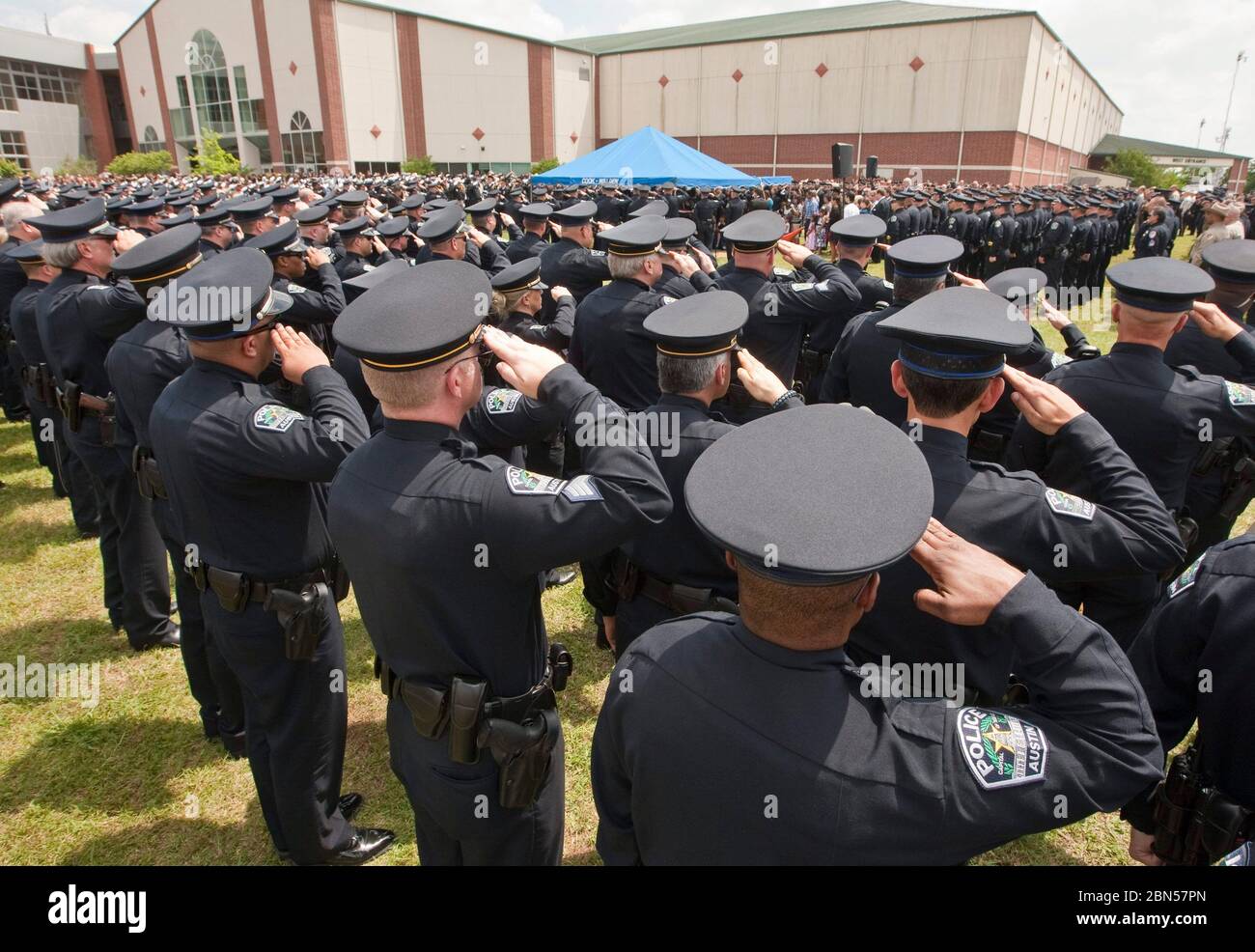 Austin, Texas USA, April 12, 2012: Hundreds of uniformed police officers salute while paying tribune at funeral for slain Austin police officer Jaime Padron, killed in the line of duty.  ©Marjorie Kamys Cotera/Daemmrich Photography Stock Photo
