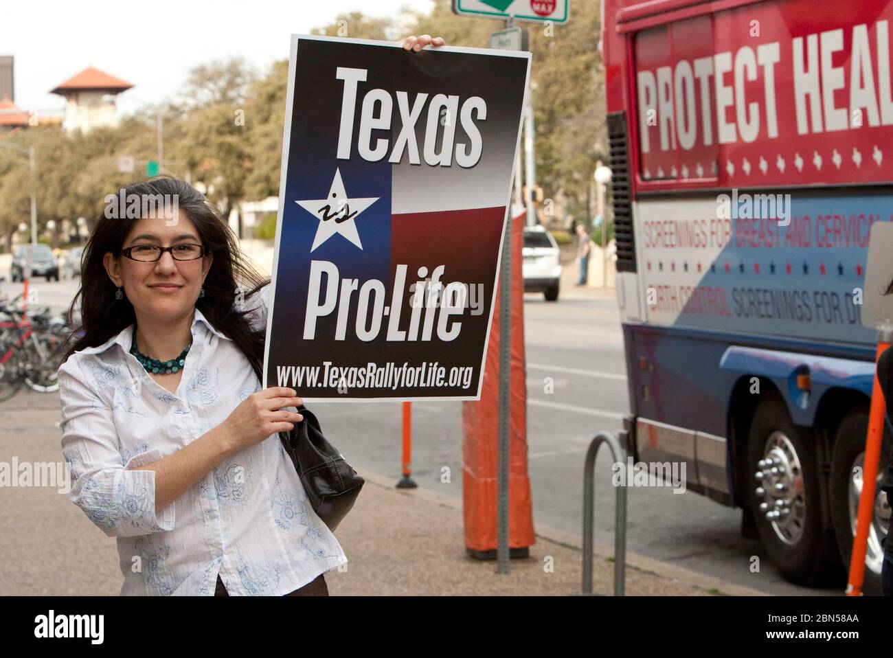 Austin Texas USA, March 6, 2012: A young woman holds a pro-life sign at a pro-choice rally. ©Marjorie Kamys Cotera/Daemmrich Photography Stock Photo