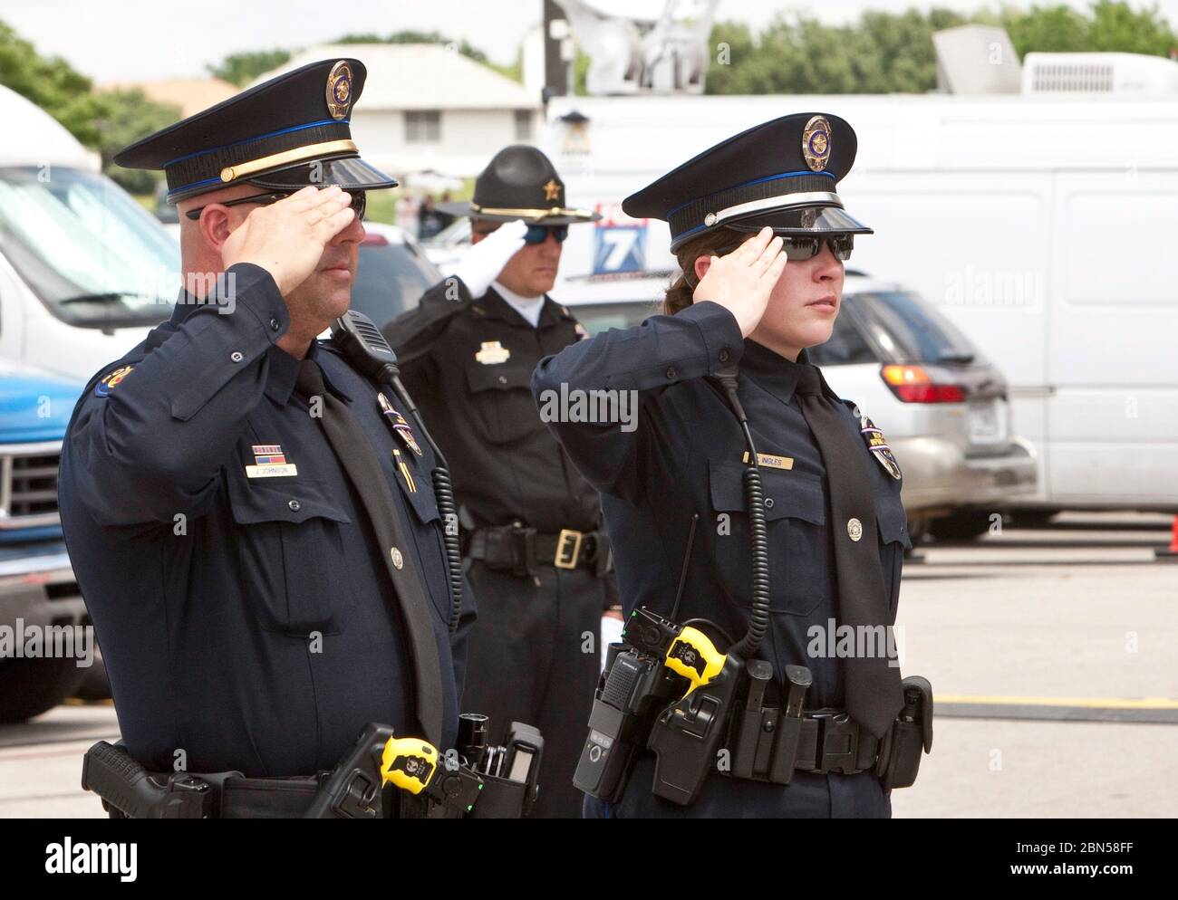 Austin Texas USA, April 11 2012: Uniformed police officers pay tribune at funeral of Austin Police Department officer Jaime Padron, who was killed in the line of duty.  ©Marjorie Kamys Cotera/Daemmrich Photography Stock Photo