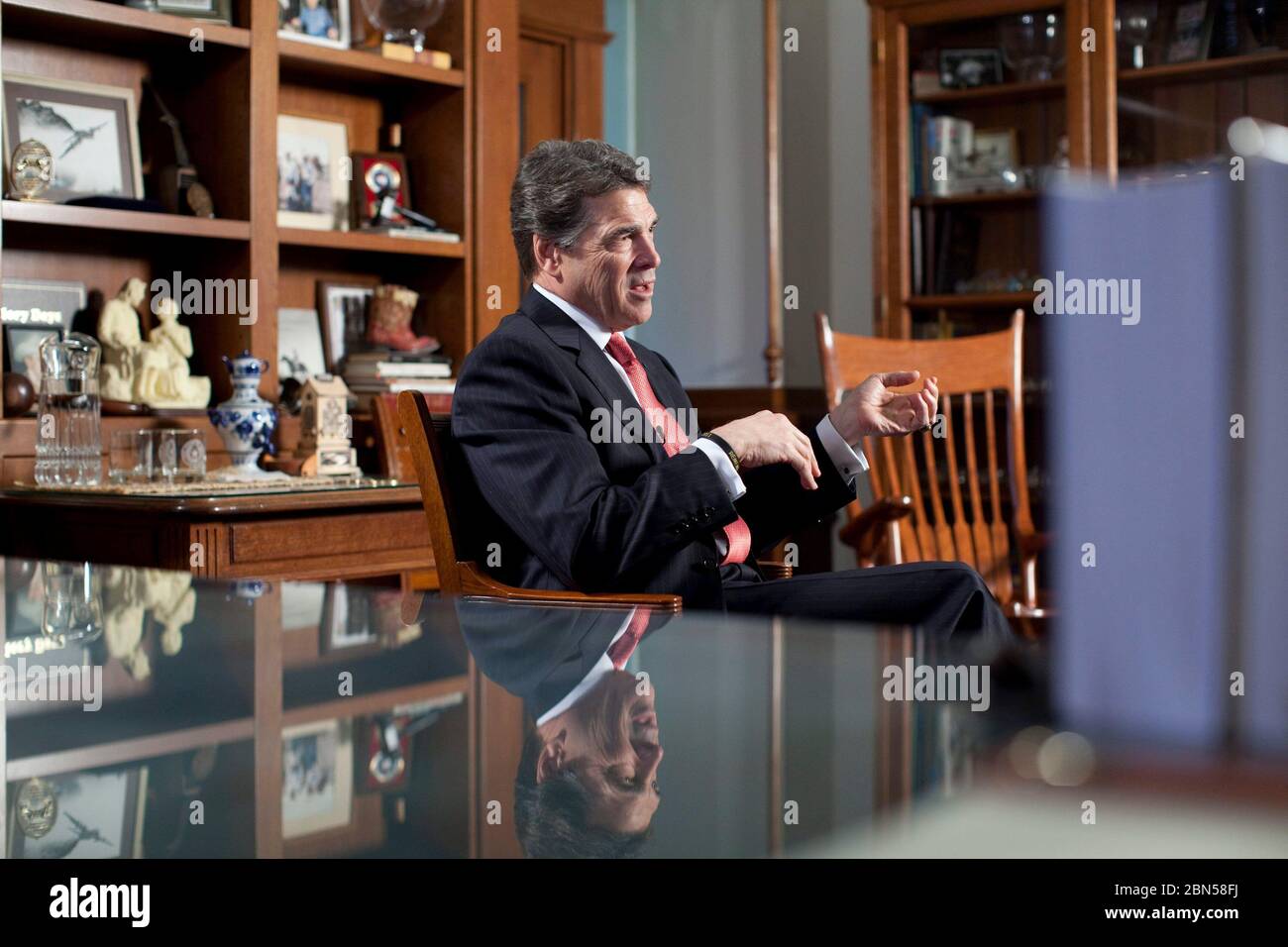 Austin Texas USA, February 21, 2012: Texas Gov. Rick Perry sits in his Capitol office for his first extended interview since dropping a bid for the Republican presidential nomination. He said he definitely will run for reelection as Texas governor in 2014 and possibly take another stab at the 2016 presidential race. Of his infamous 'oops' gaffe, he said, 'Obviously it embarrasses you...From my perspective, I'd rather it not have happened.'   ©Bob Daemmrich Stock Photo