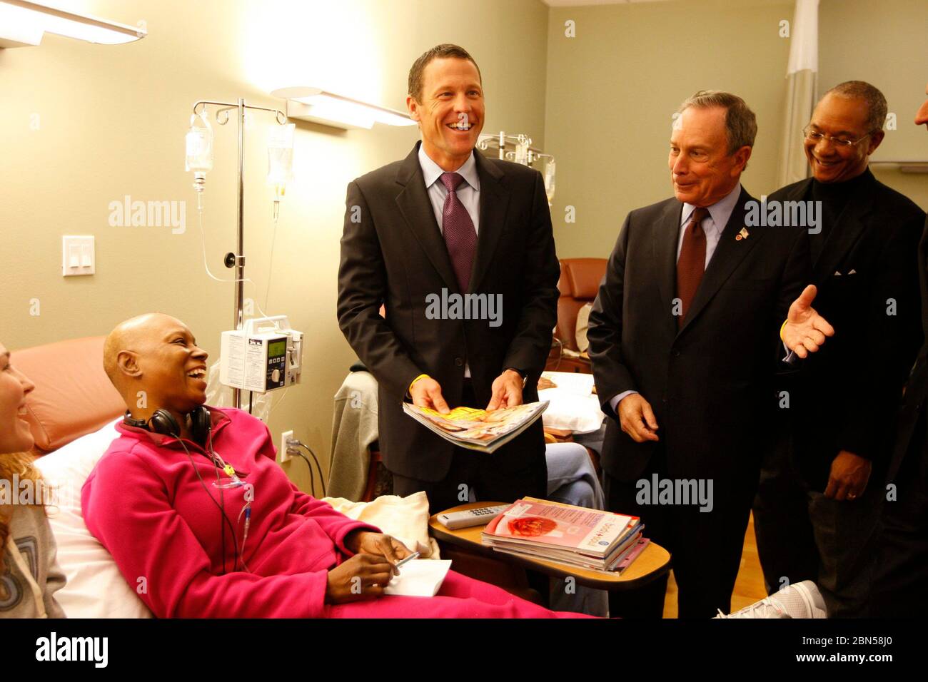 Austin, Texas USA, January 18, 2008: Five-time Tour de France winner and cancer survivor Lance Armstrong and New York City mayor Michael Bloomberg speak to reporters at a patient's bedside about a new cancer health initiative.  ©Bob Daemmrich Stock Photo