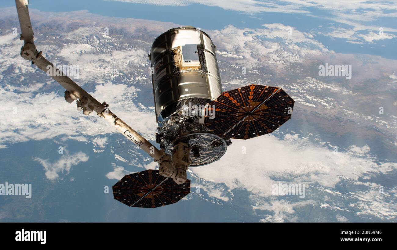 International Space Station, Earth Orbit. 11th May, 2020. International Space Station, EARTH ORBIT. 11 May, 2020. The Northrop Grumman Cygnus spacecraft with the distinct cymbal shaped UltraFlex solar arrays is positioned for release by the CanadaArm2 ending its 83-day stay at the International Space Station May 11, 2020 in Earth Orbit. Credit: NASA/NASA/Alamy Live News Stock Photo