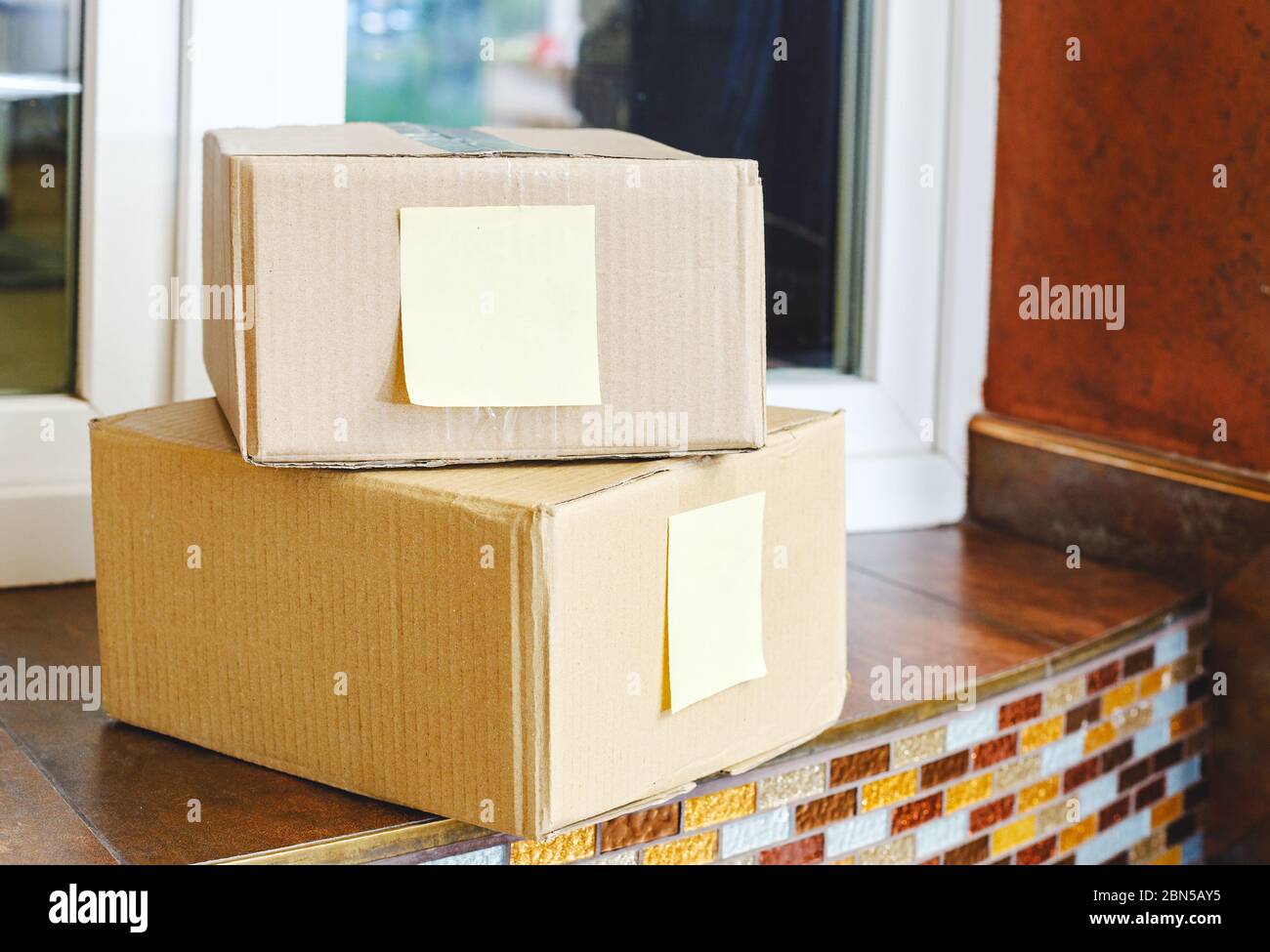 Delivery boxes on doorstep near home door. Contactless food delivery