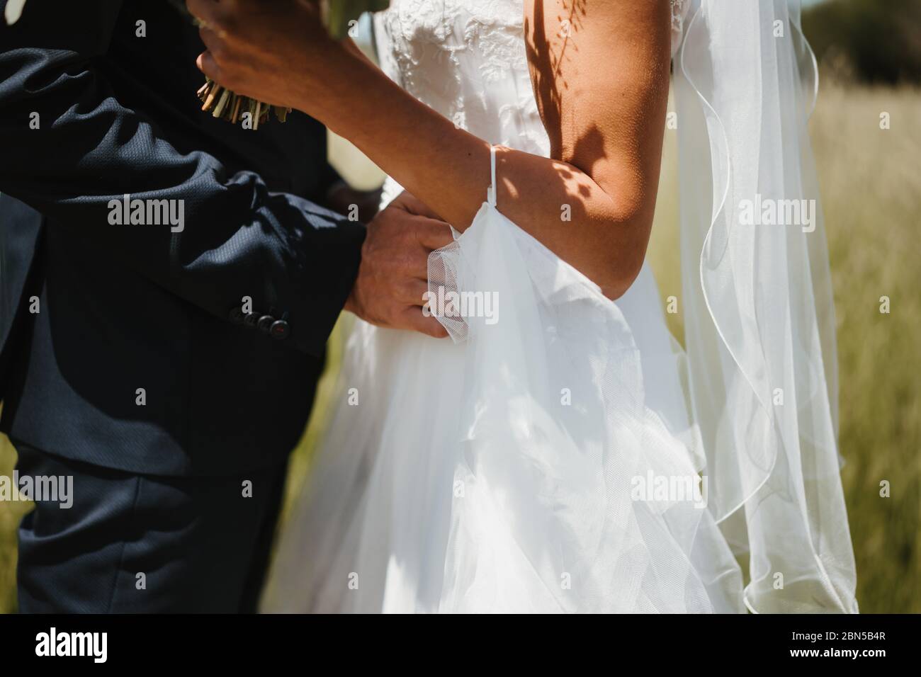Wedded photo of wedded couple in a field Stock Photo - Alamy