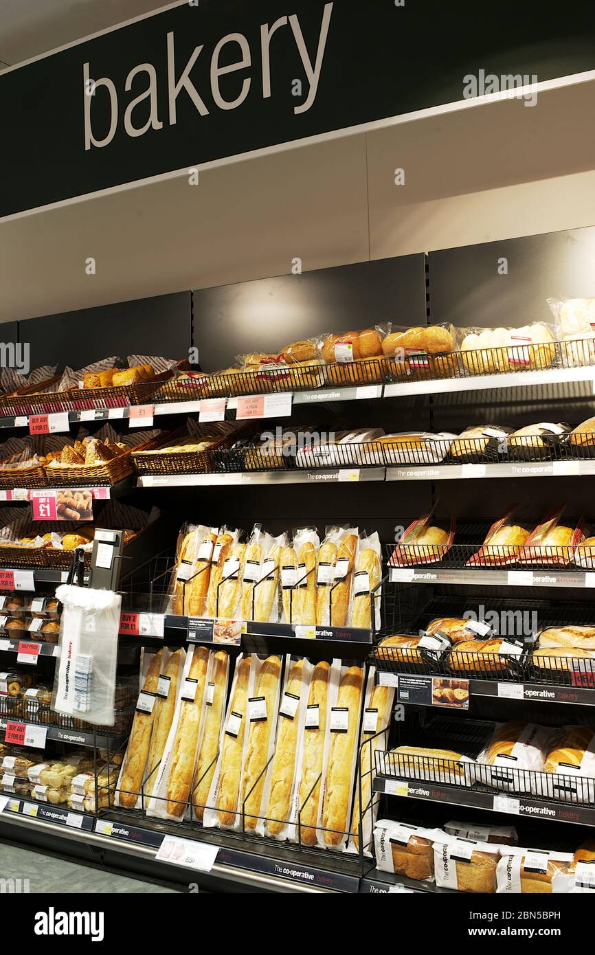 supermarket bakery display showing loaf, bread rolls,  Stock Photo
