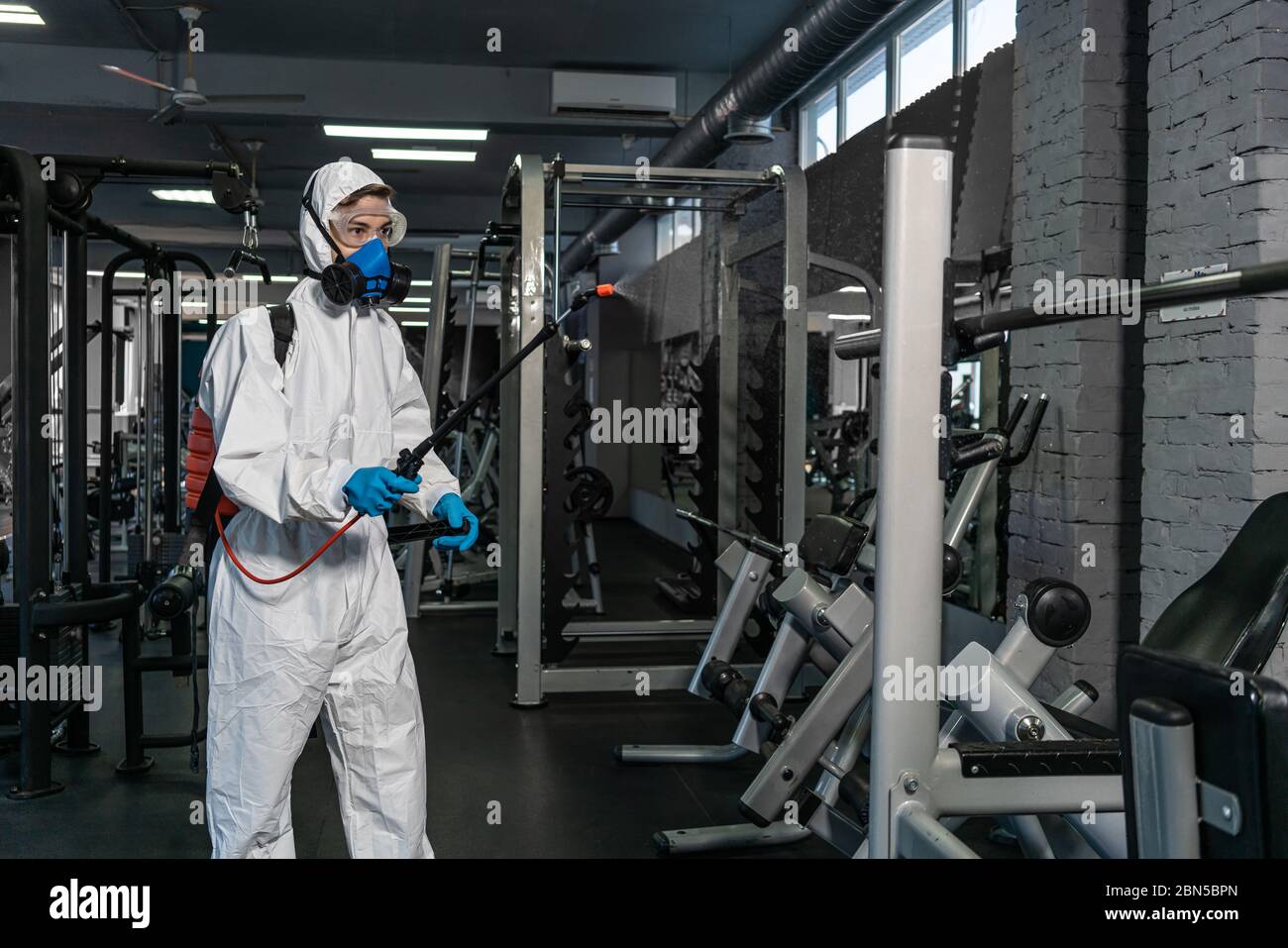 Cleaning and Disinfection in crowded places amid the coronavirus epidemic Gym cleaning and disinfection Infection prevention and control of epidemic. Stock Photo