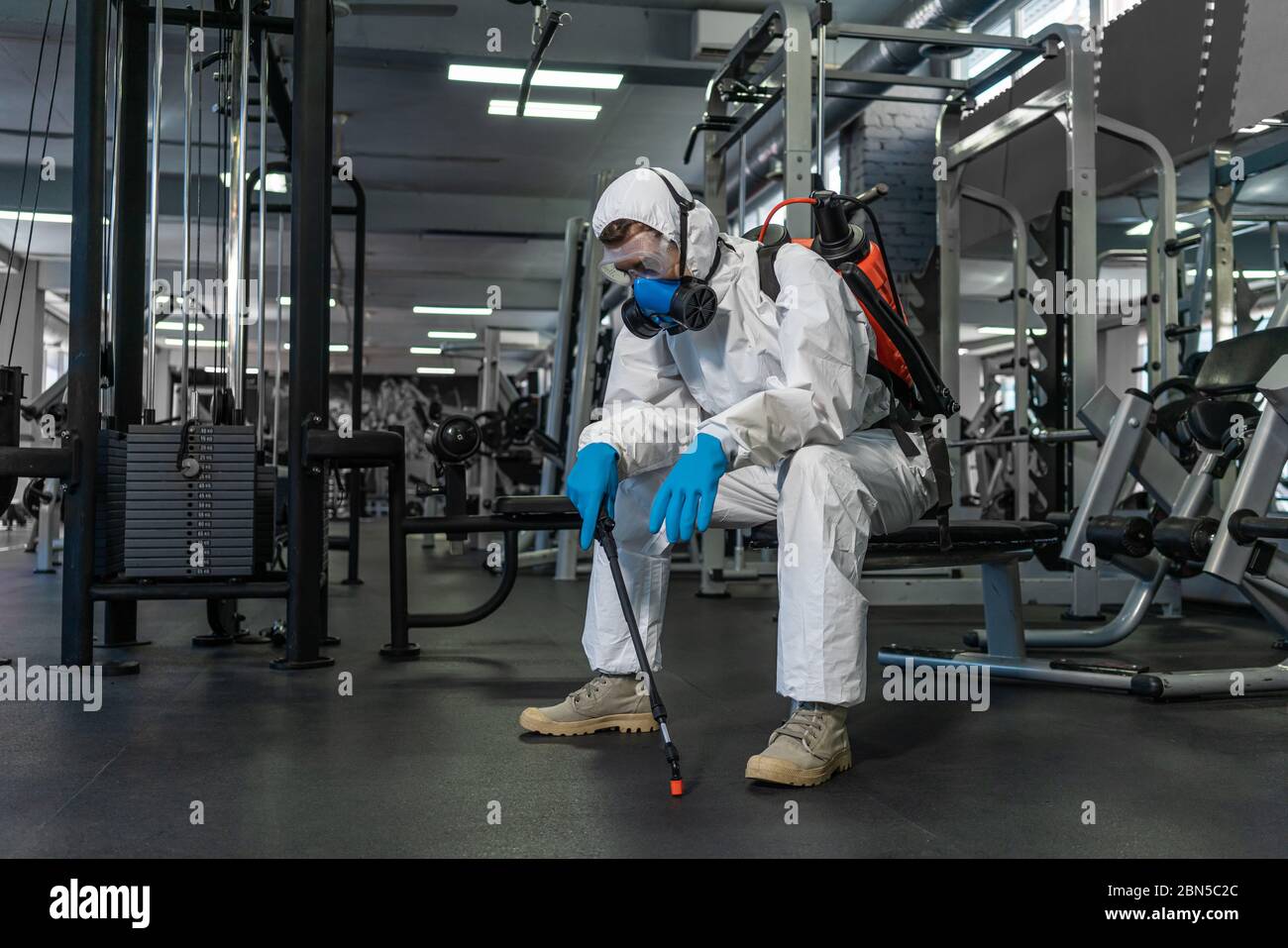 Cleaning and Disinfection in crowded places amid the coronavirus epidemic Gym cleaning and disinfection Infection prevention and control of epidemic. Stock Photo