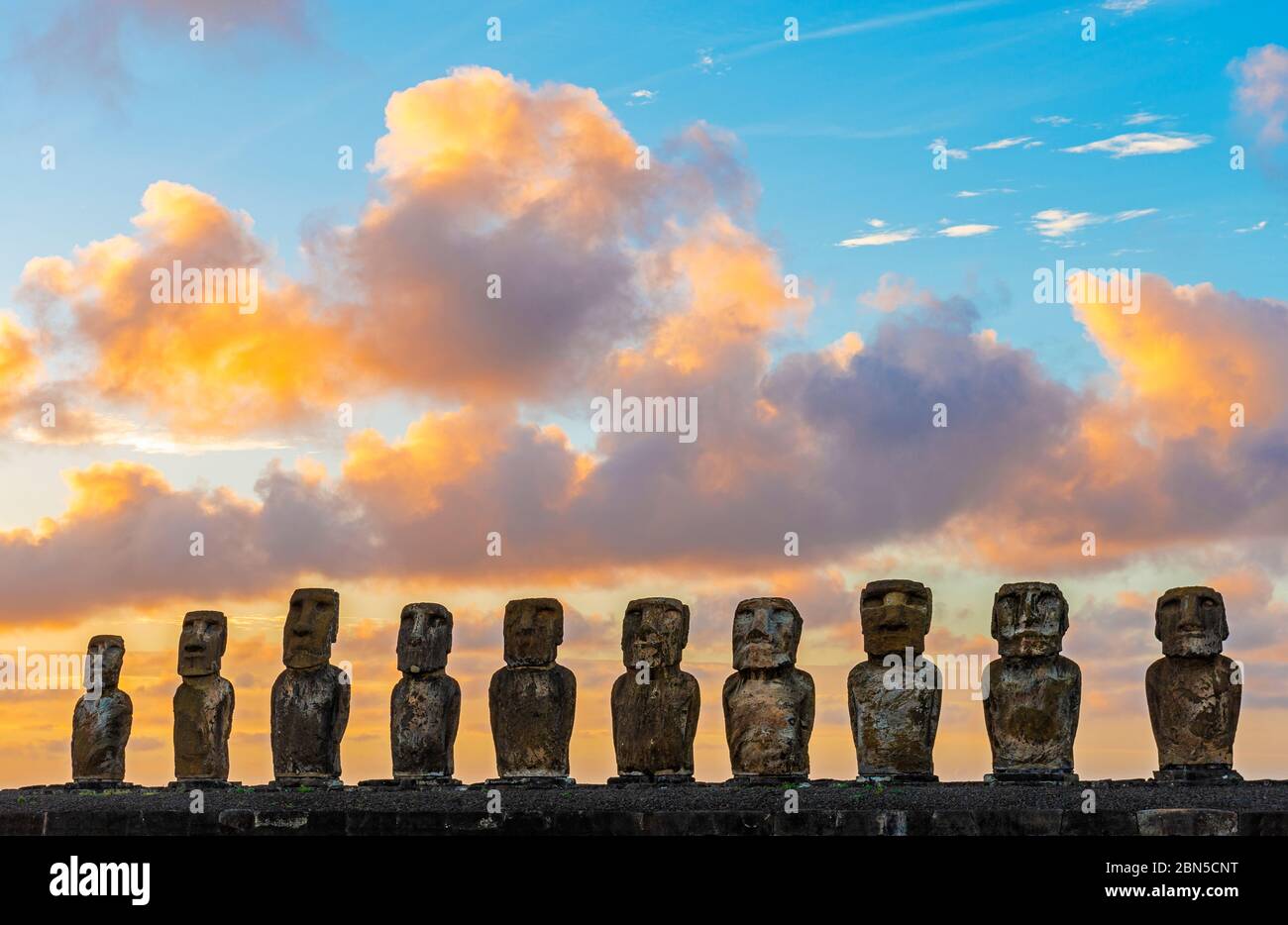 The Moai statues of Ahu Tongariki at Sunrise, Easter Island (Rapa Nui), Chile. Stock Photo