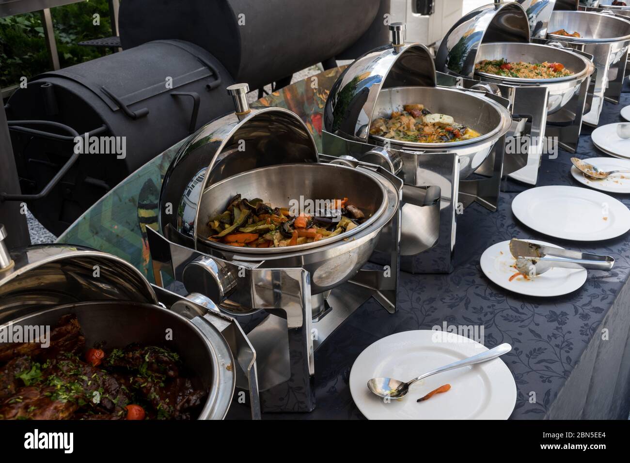 Live food stations. Kitchenware in the line catering summer brunch buffet  food luxury hotel outdoor outside garden by the pool al fresco restaurant.Co  Stock Photo - Alamy