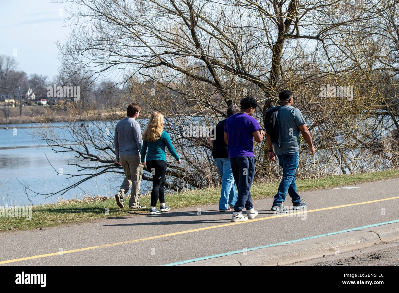 St. Paul, Minnesota.  Como Park. Over crowding in the park. People not paying attention to the social distancing rule while walking in the park. Stock Photo