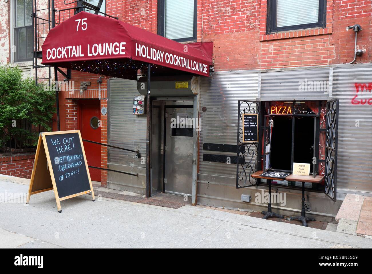 Holiday Cocktail Lounge, 75 Saint Marks Place, New York, NY. exterior storefront of a cocktail lounge in the East Village neighborhood of Manhattan. Stock Photo