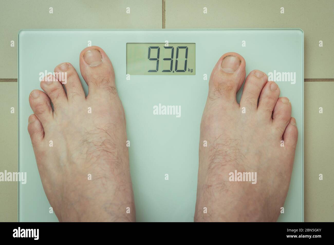 Fat person scales hi-res stock photography and images - Alamy