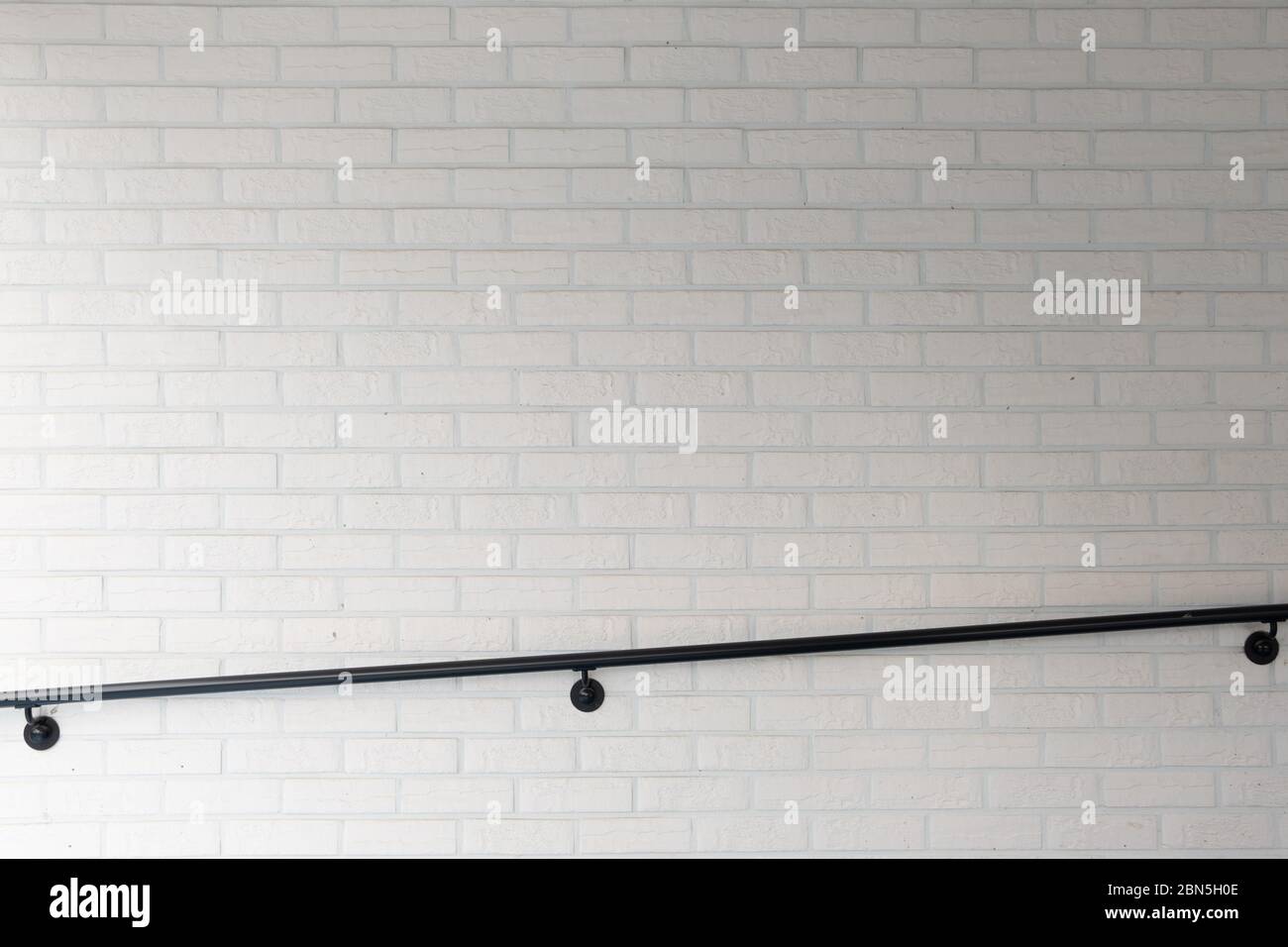 Modern architecture. White brick wall and handrail Stock Photo