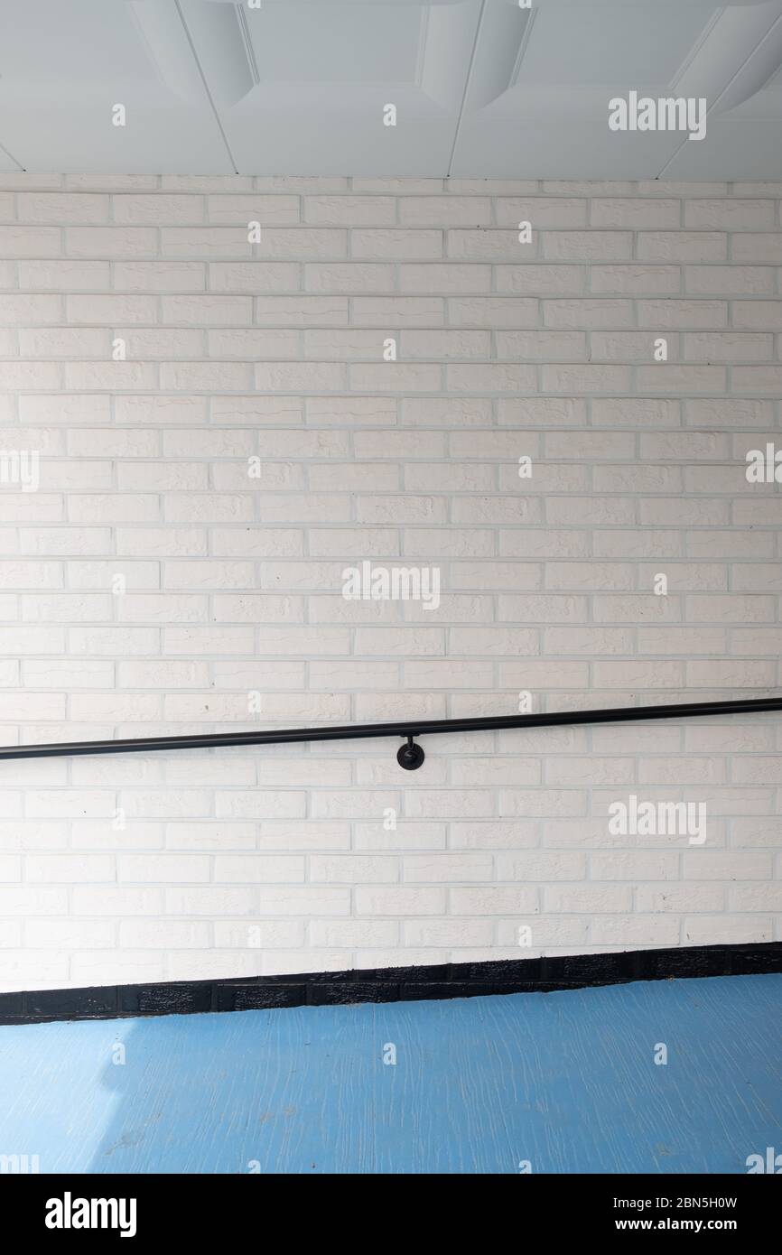 Modern architecture. White brick wall and handrail Stock Photo