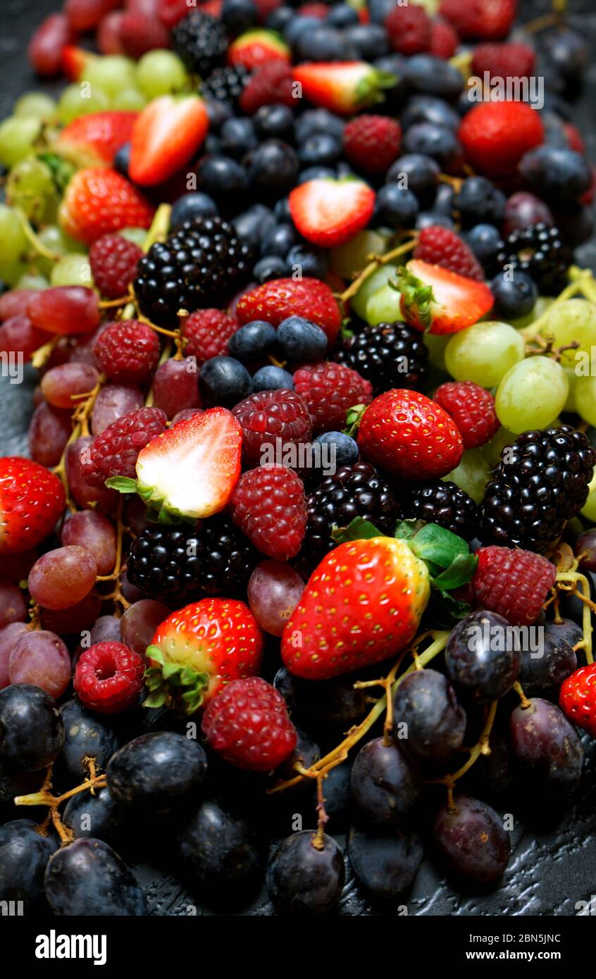 Summer berries food background full frame close up with strawberries ...
