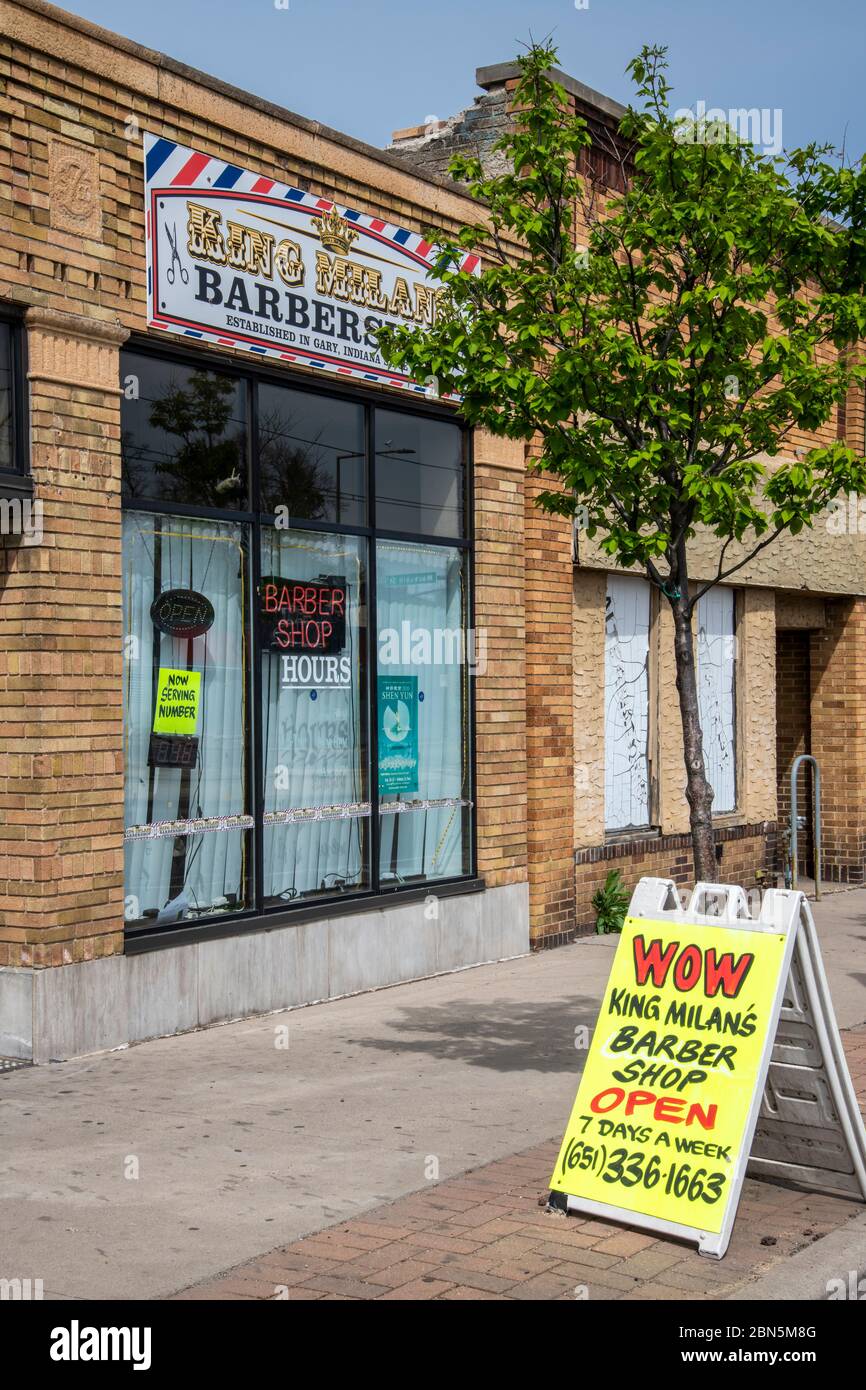 St. Paul, Minnesota.  A local barber shop reopens its doors despite the order for lockdown during the coronavirus pandemic. Stock Photo