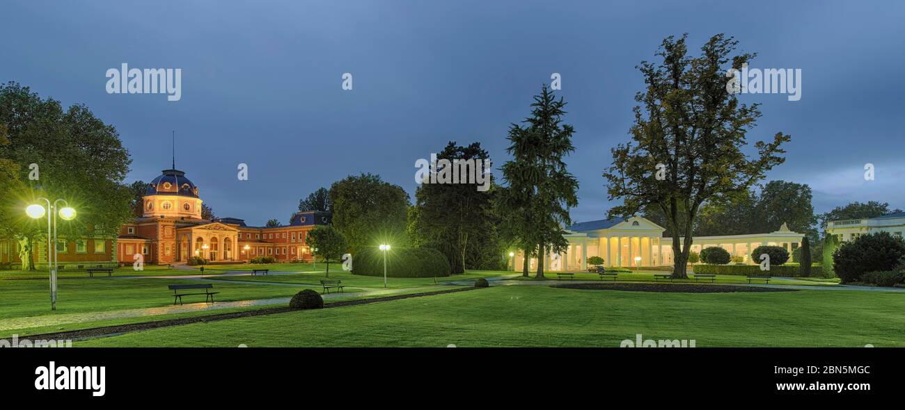 Spa garden at dusk, illuminated, panorama, foyer and bathhouse, Bad Oeynhausen, Germany Stock Photo