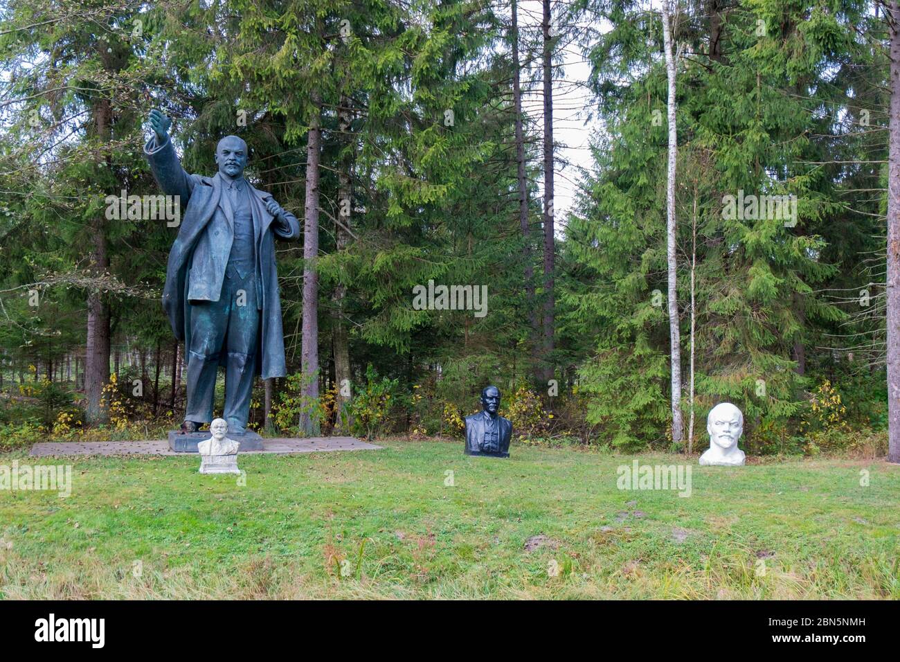 A large, bronze statue of Lenin with smaller busts of him. At Gruto Parkas near Druskininkai, Lithuania. Stock Photo
