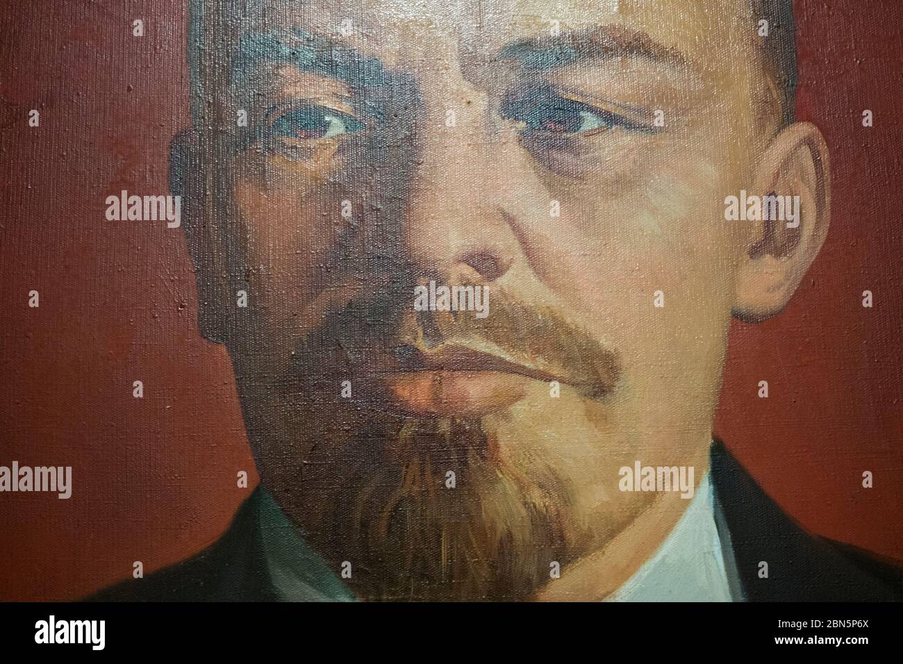 A close up of a painting of Lenin with an interesting reflection, glare. At Gruto Parkas near Druskininkai, Lithuania. Stock Photo