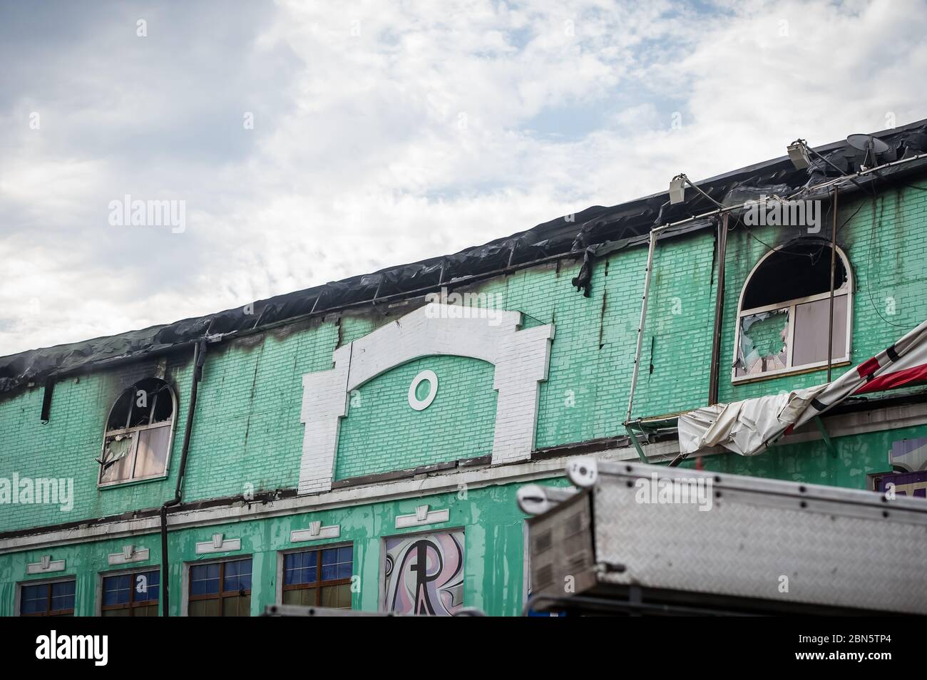 Old apartment building with black Windows after the fire. A dysfunctional building. Accident Stock Photo