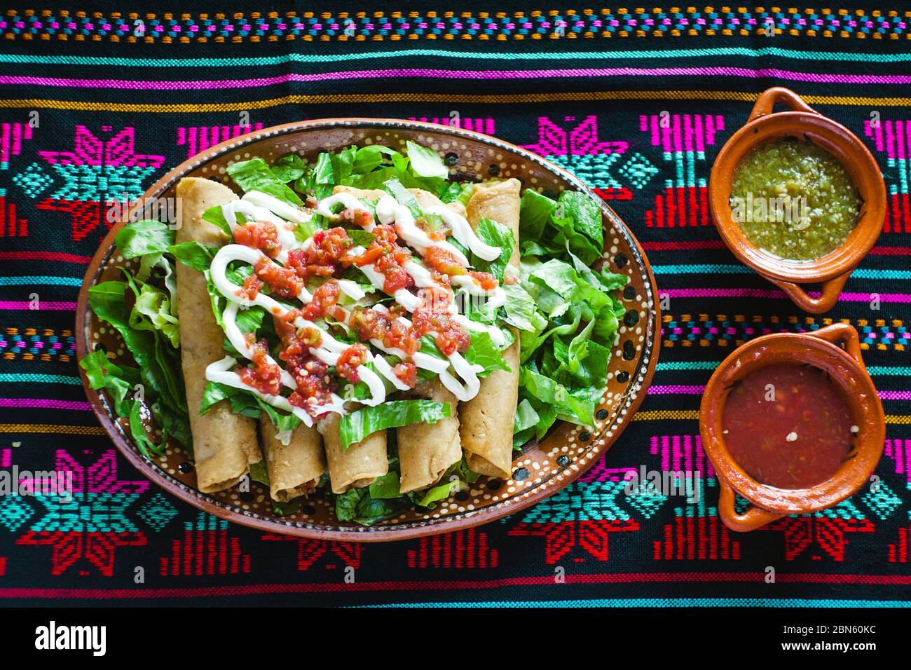 flautas de pollo, chicken tacos dorados and Salsa Homemade Mexican food in  mexico city Stock Photo - Alamy